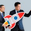 businessmen-holding-launching-rocket-icon_53876-24913