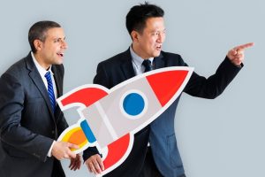 businessmen-holding-launching-rocket-icon_53876-24913