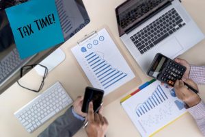 high-angle-view-business-colleagues-working-desk-office_1048944-19659610